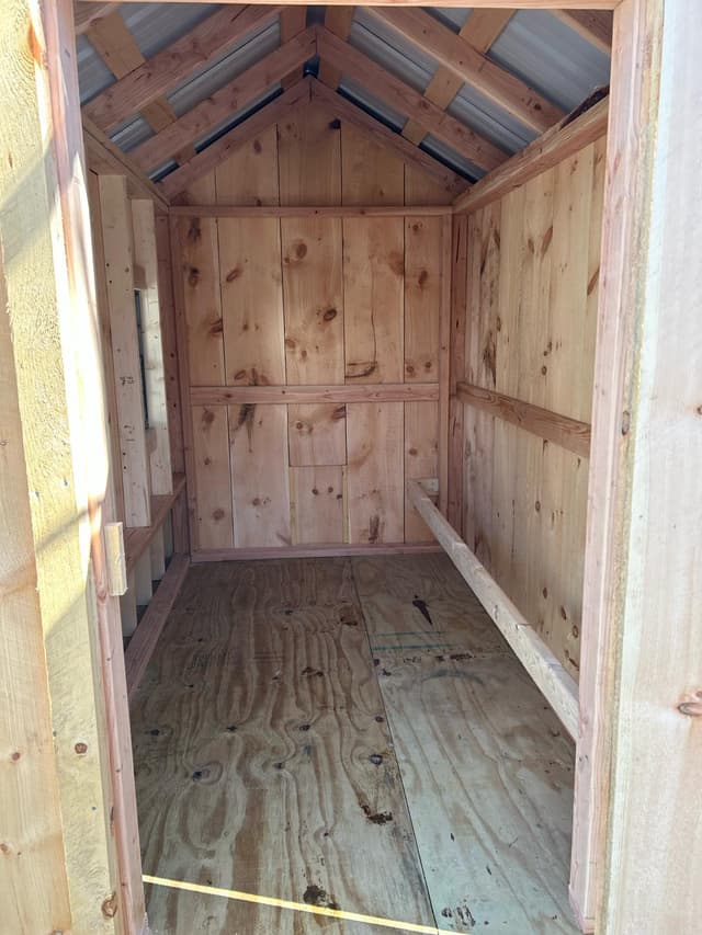 picture of a shed with the shed door open